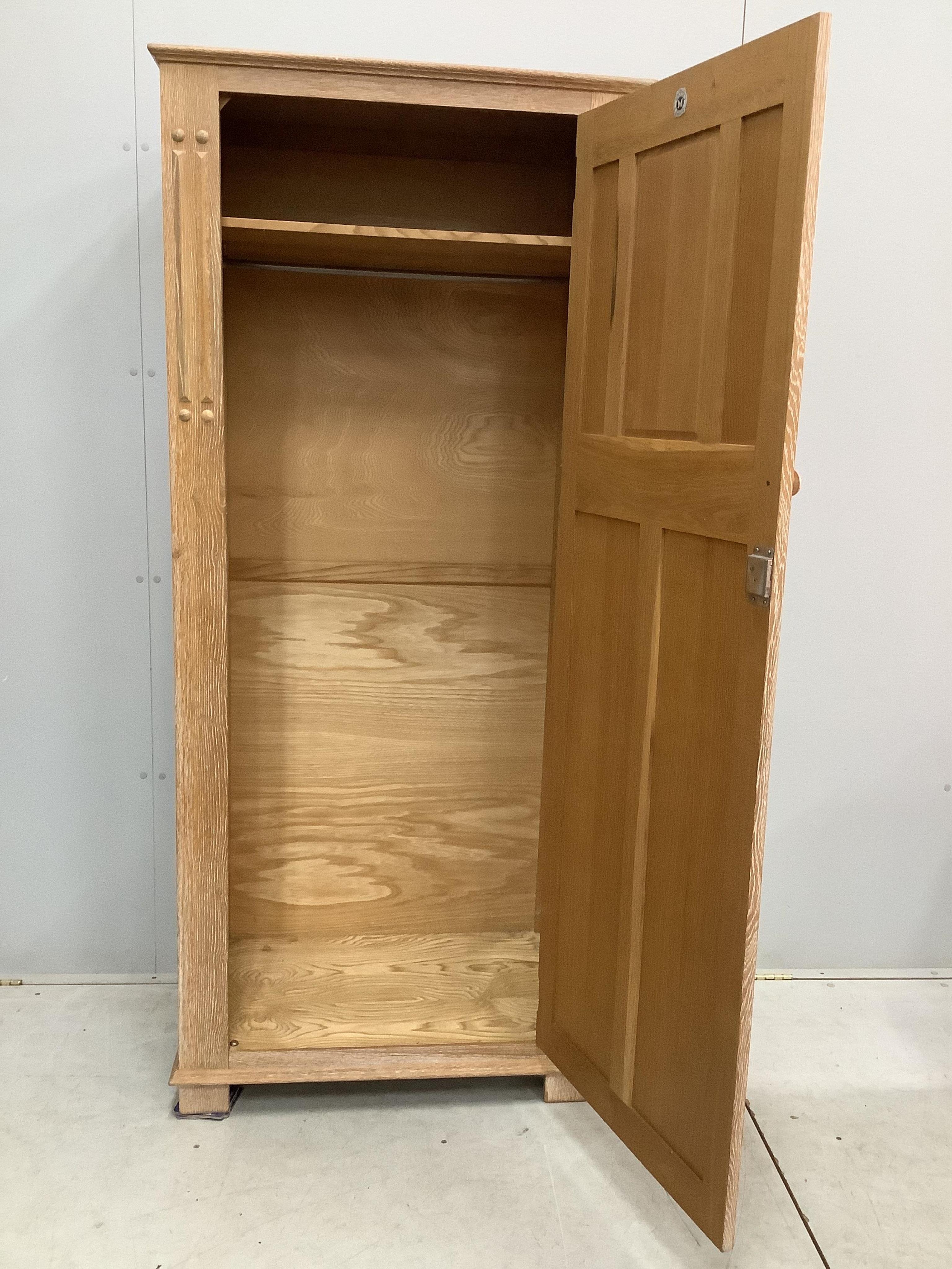 A limed oak four piece bedroom suite, comprising wardrobe, three drawer chest and a pair of single headboards. Condition - good